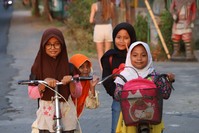 Local girls on bicycles, Indonesia