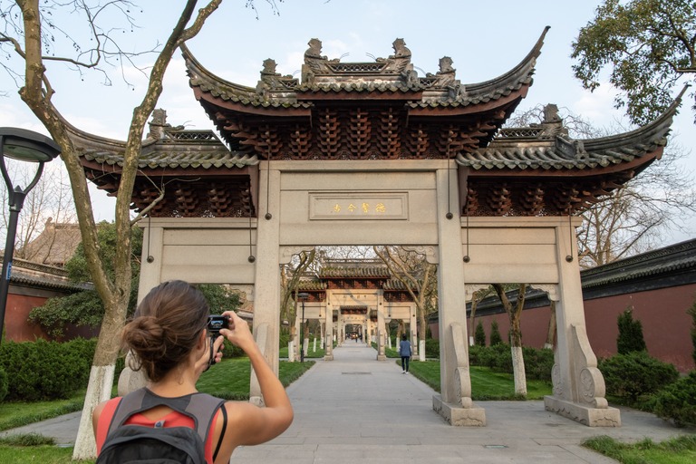 Hangzhou, women taking photo of temple gate